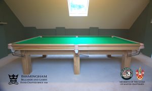 The Retro-luxury handmade pool table, with 6 legs in light oak, olive green baize